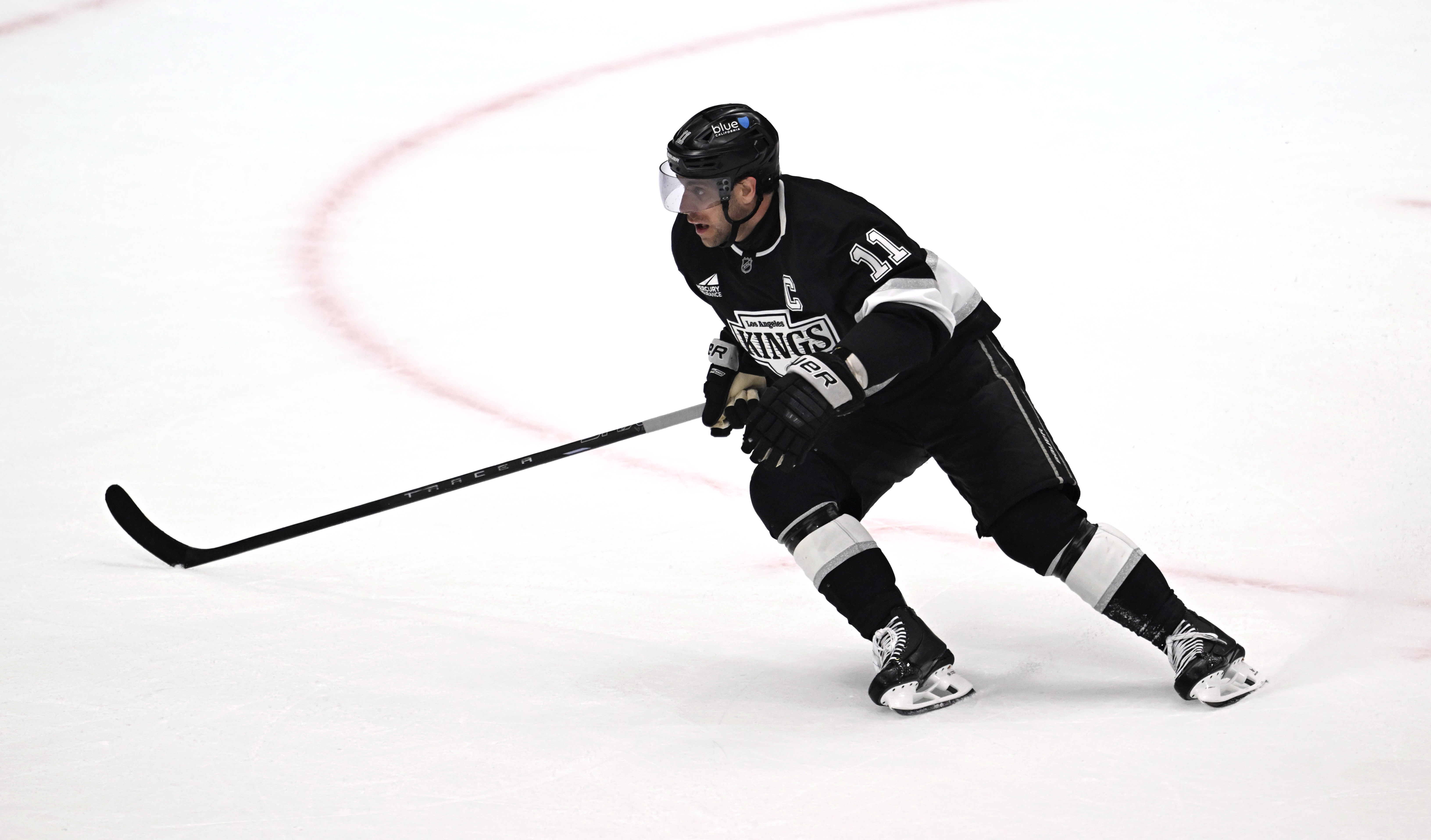 Kings center Anze Kopitar skates during the first period of...