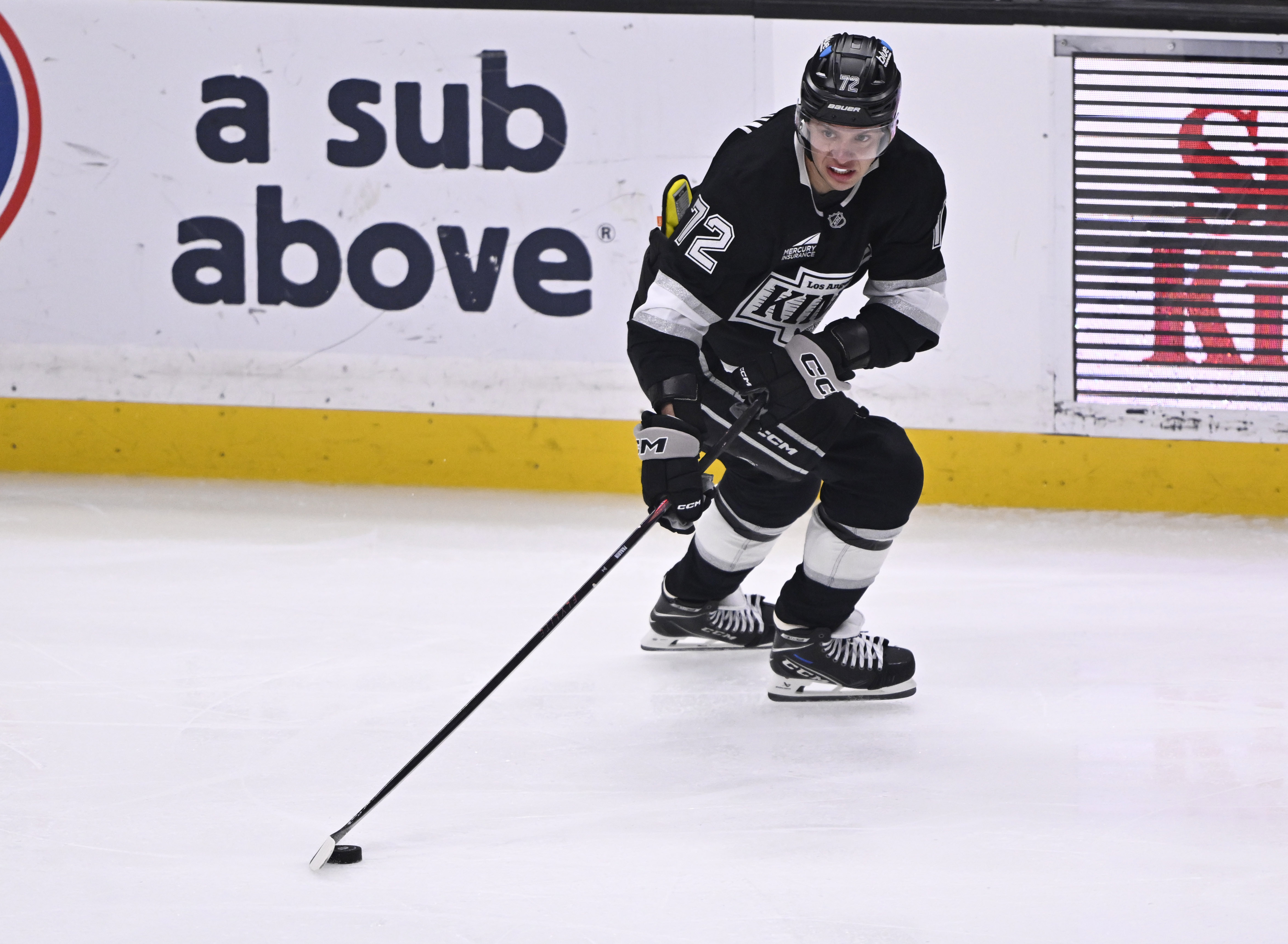 New Kings forward Artemi Panarin controls the puck during the...