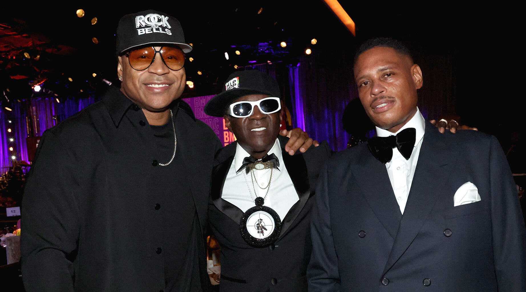 BEVERLY HILLS, CALIFORNIA - SEPTEMBER 21: (L-R) LL Cool J Flavor Flav and BMAC co-founder Shawn Holiday attend the BMAC Gala presented by Live Nation at The Beverly Hilton on September 21, 2023 in Beverly Hills, California. (Photo by Johnny Nunez/Getty Images for Black Music Action Coalition)