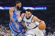 Orlando Magic guard Tyus Jones (2) drives against Oklahoma City Thunder guard Isaiah Joe,...