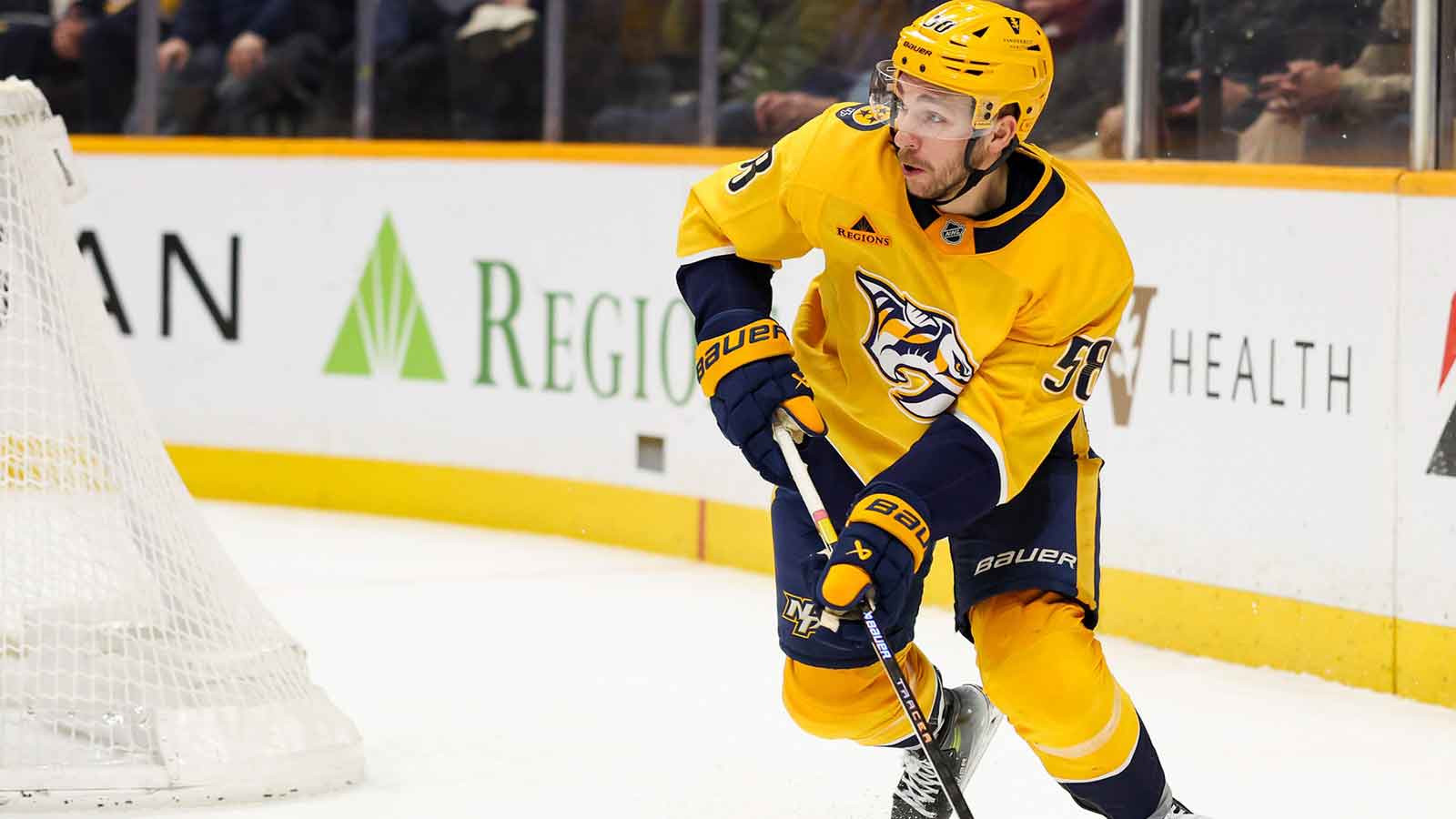 Nashville Predators left wing Michael Bunting (58) skates behind the net against the Ottawa Senators during the third period at Bridgestone Arena. 