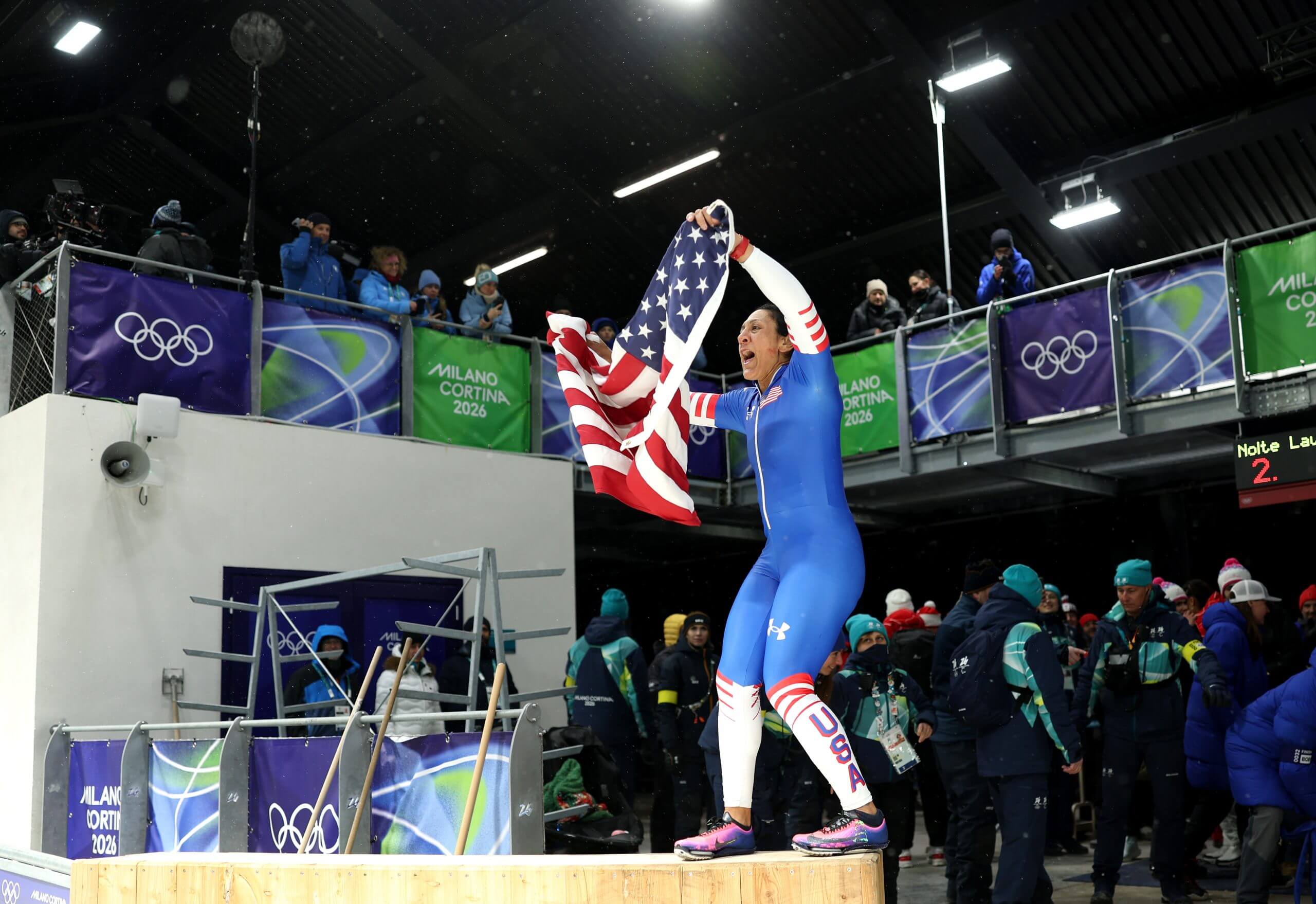 Elana Meyers Taylor of Team USA celebrates after winning the gold medal in women's monobob bobsleigh Monday at the Cortina Sliding Centre.