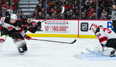 New Jersey Devils' Simon Nemec and Jake Allen combine to defend Senators Captain Brady Tkachuk.