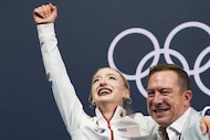 Amber Glenn of the United States reacts to her score after competing in the women's figure...