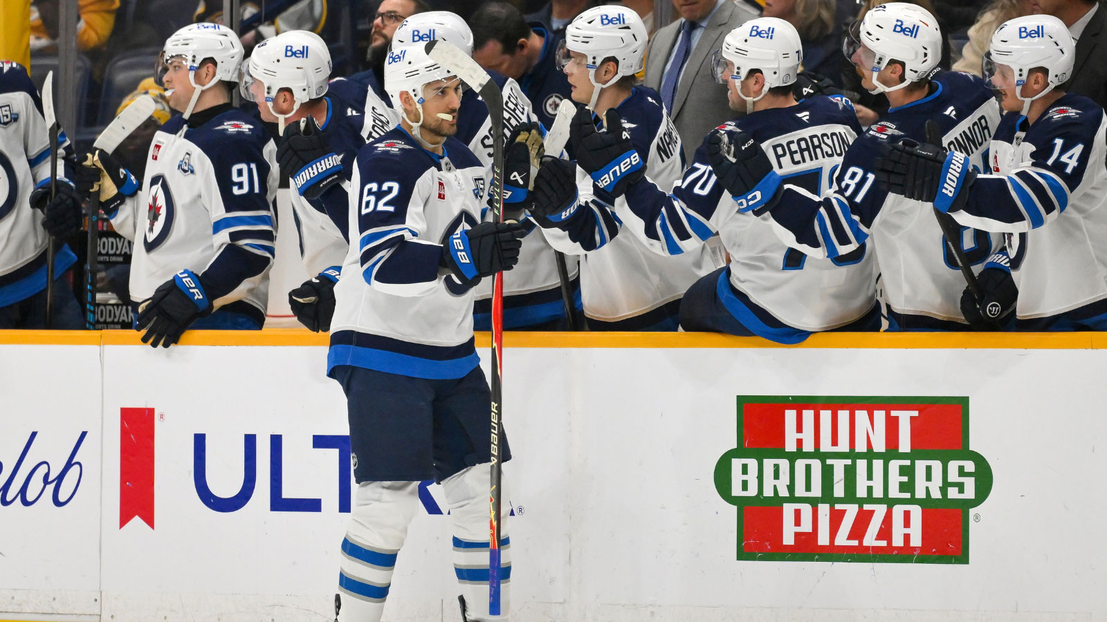 Winnipeg Jets right wing Nino Niederreiter (62) celebrates with his teammates after scoring a goal against the Nashville Predators during the first period at Bridgestone Arena.