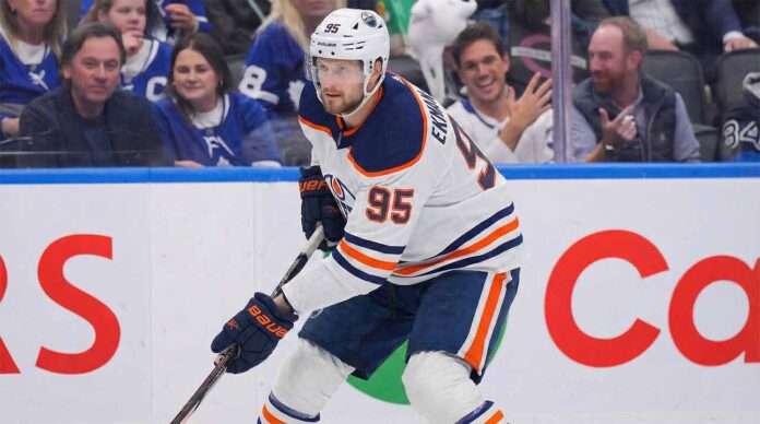 A concept visualization showing current Toronto Maple Leafs defenseman Oliver Ekman-Larsson (95) wearing a white Edmonton Oilers away jersey, helmet, and gloves, skating with the puck during a game environment.