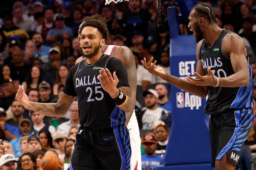 Dallas Mavericks forward P.J. Washington (25) and Dallas Mavericks center Moussa Cisse (30)...