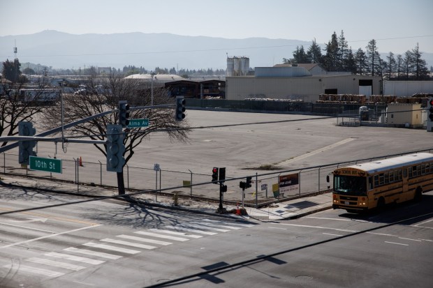 A school bus drives past the former Lorentz Barrel and Drum Company property at the corner of South 10th Street and East Alma Avenue in San Jose on Friday, Feb. 6, 2026. (Dai Sugano/Bay Area News Group)