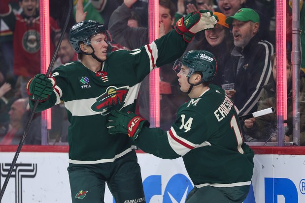 Minnesota Wild center Joel Eriksson Ek, right, celebrates his goal with left wing Matt Boldy.