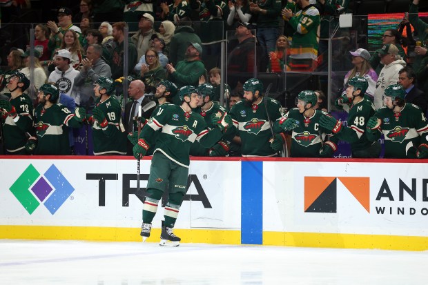 Joel Eriksson Ek #14 of the Minnesota Wild celebrates his goal 