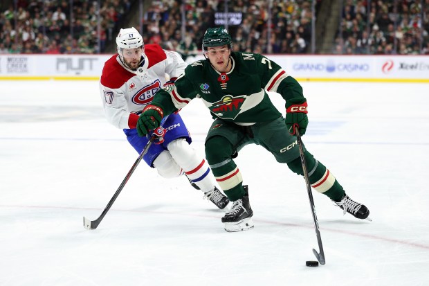 Brock Faber #7 of the Minnesota Wild skates the puck