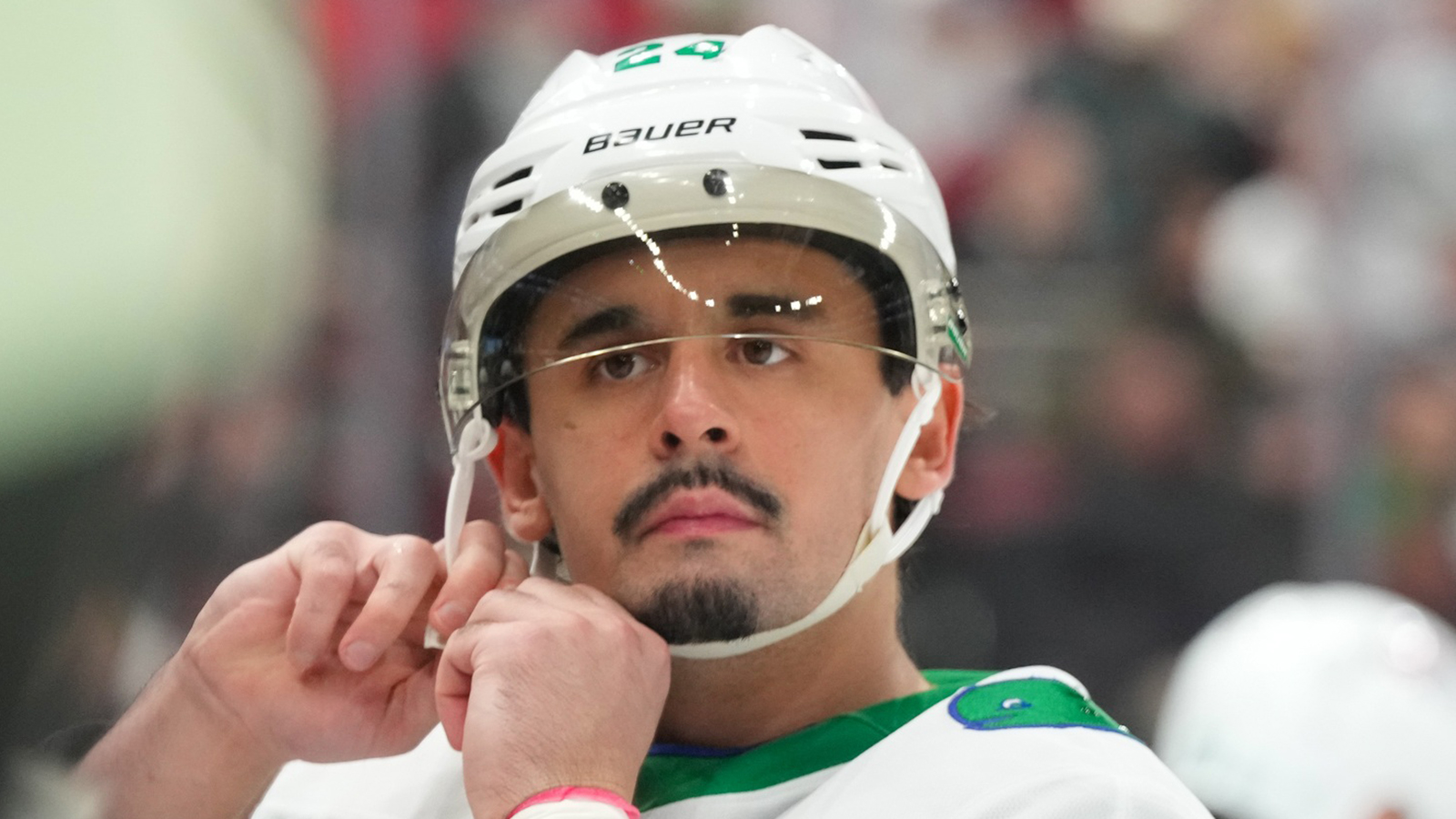 Seth Jarvis adjusting his helmet