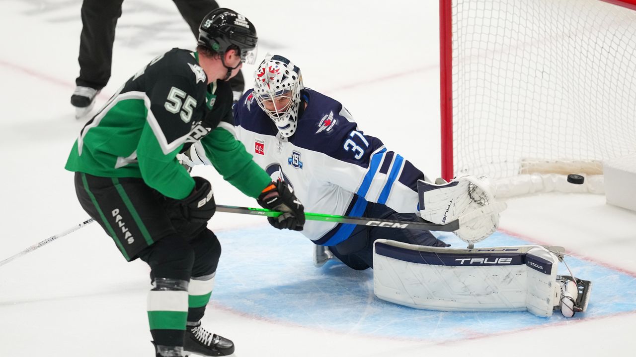 Dallas Stars defenseman Thomas Harley (55) scores the game-winning goal on Winnipeg Jets goaltender Connor Hellebuyck during overtime in an NHL hockey game Monday, Feb. 2, 2026, in Dallas. (AP Photo/Julio Cortez)