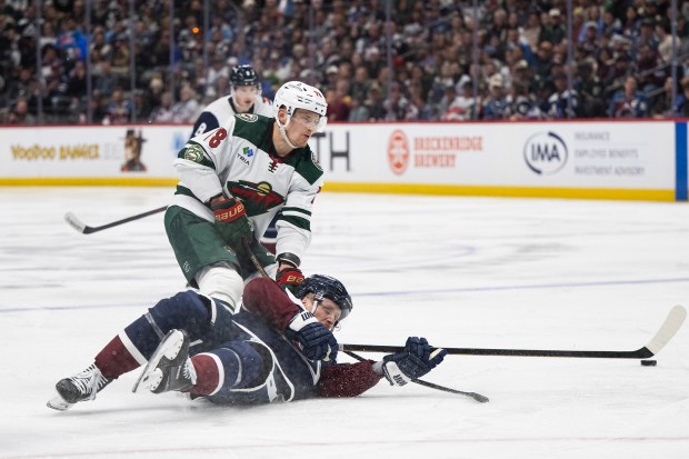 Gabriel Landeskog (92) of the Colorado Avalanche goes down hard in front of Nico Sturm (78) of the Minnesota Wild during a 5-2 loss to the Wild on Thursday, Feb. 26, 2026, at Ball Arena in Denver. (Photo by Timothy Hurst/The Denver Post)