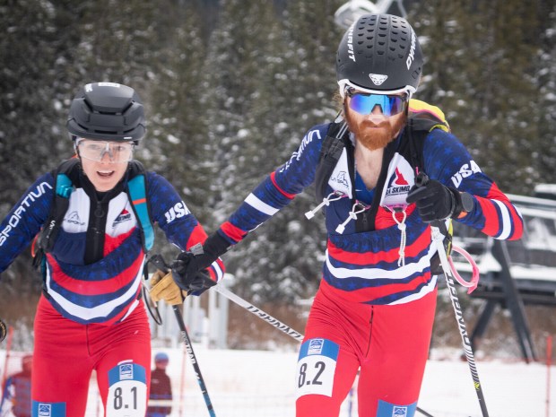 Anna Gibson, left, and her partner Cam Smith compete during a World Cup ski mountaineering mixed team relay at Solitude Mountain in Utah, Dec. 6, 2025. (Ron Winsett/ISMF via AP)