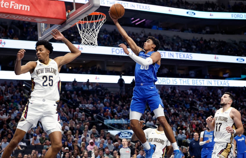 Dallas Mavericks guard Max Christie (00) lays up a shot against New Orleans Pelicans forward...