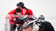 MILAN, ITALY - FEBRUARY 15: Tom Wilson of Canada roughing with Pierre Crinon of Team France during the Men's Preliminary Round Group A match between Canada and France on day nine of the Milano Cortina 2026 Winter Olympic games at Milano Santagiulia Ice Hockey Arena  on February 15, 2026 in Milan, Italy. (Photo by EyesWideOpen/Getty Images)