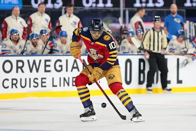 Florida Panthers forward A.J. Greer plays the puck during 2026 game. Florida Panthers forward A.J. Greer plays the puck during 2026 game.