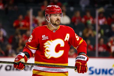 Calgary Flames defenseman Mackenzie Weegar reacts during 2025 game. Calgary Flames defenseman Mackenzie Weegar reacts during 2025 game.