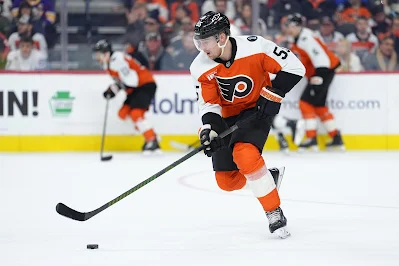 Philadelphia Flyers defenseman Rasmus Ristolainen plays the puck during 2026 game.