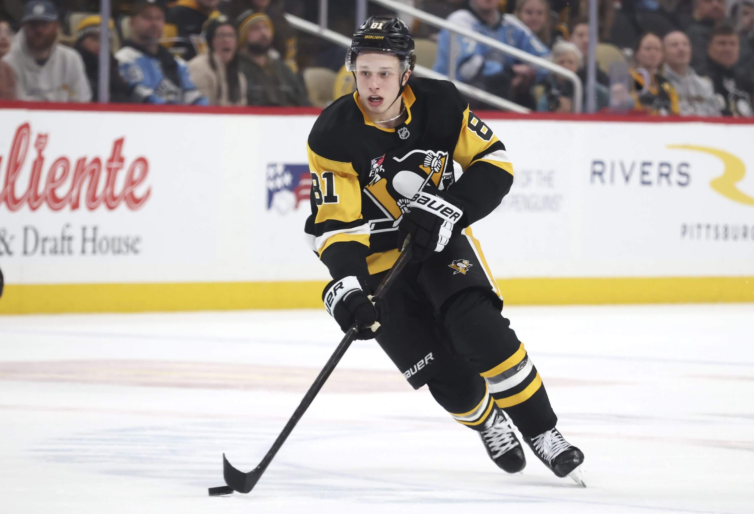 Ben Kindel skates with the puck during a Penguins game.