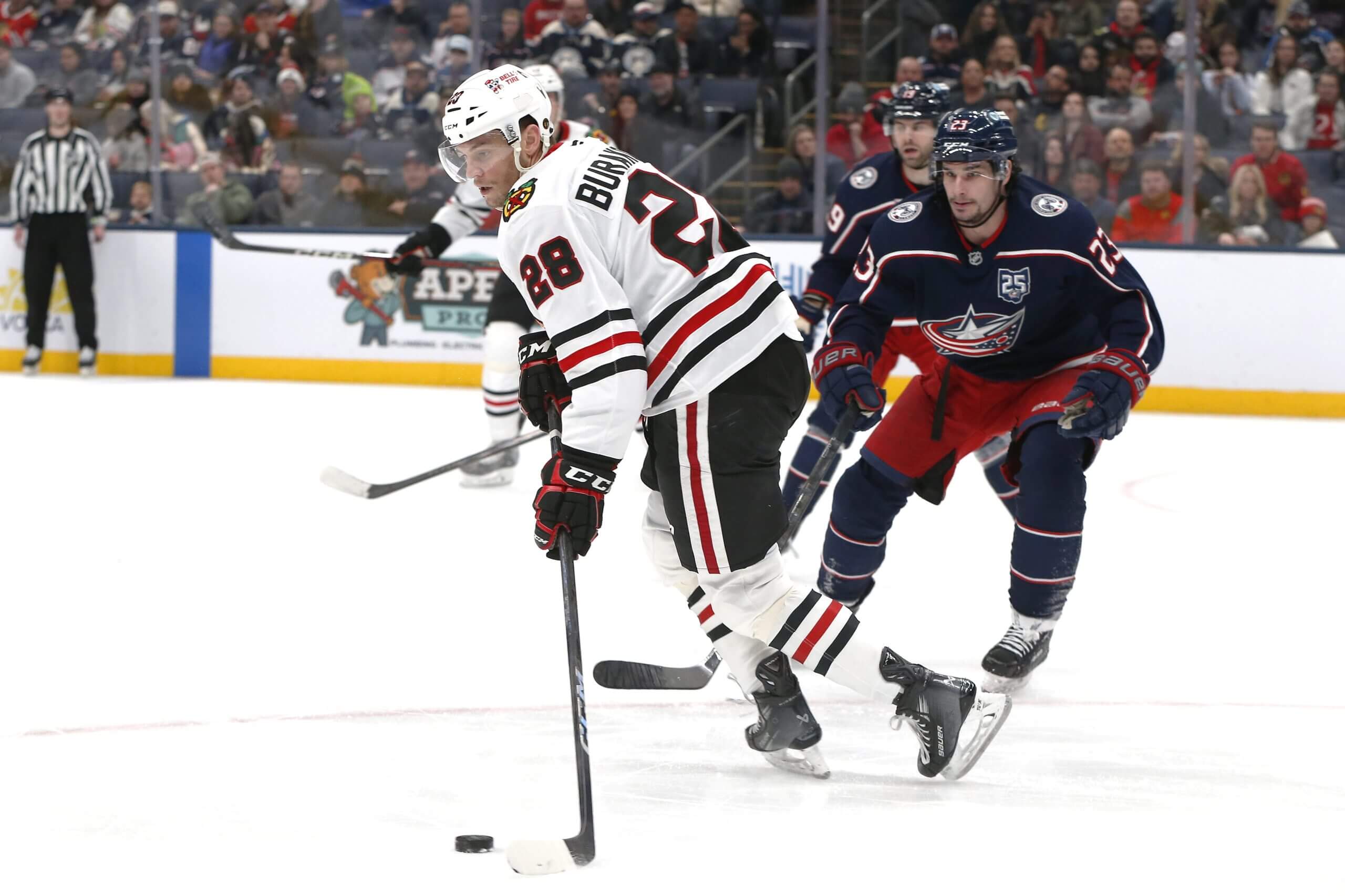 Andre Burakovsky skates with the puck against the Columbus Blue Jackets.