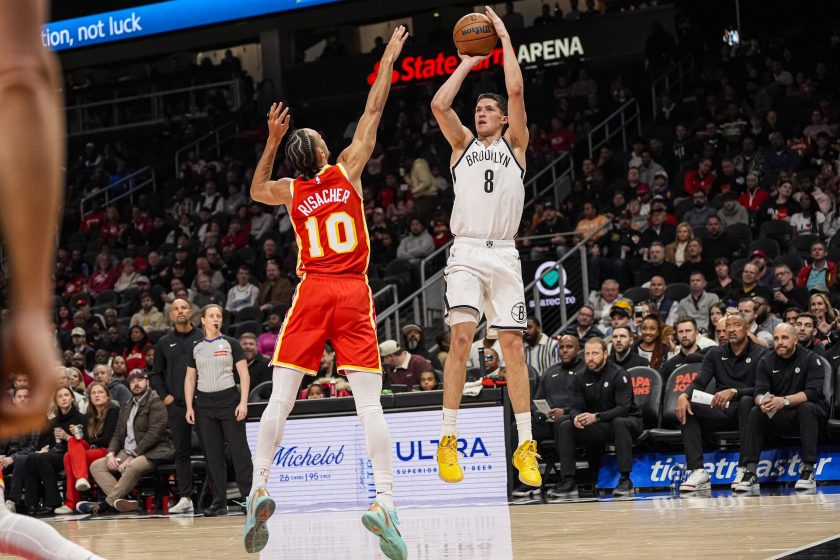 Feb 22, 2026; Atlanta, Georgia, USA; Brooklyn Nets guard Egor Demin (8) shoots over Atlanta Hawks forward Zaccharie Risacher (10) during the first half at State Farm Arena.