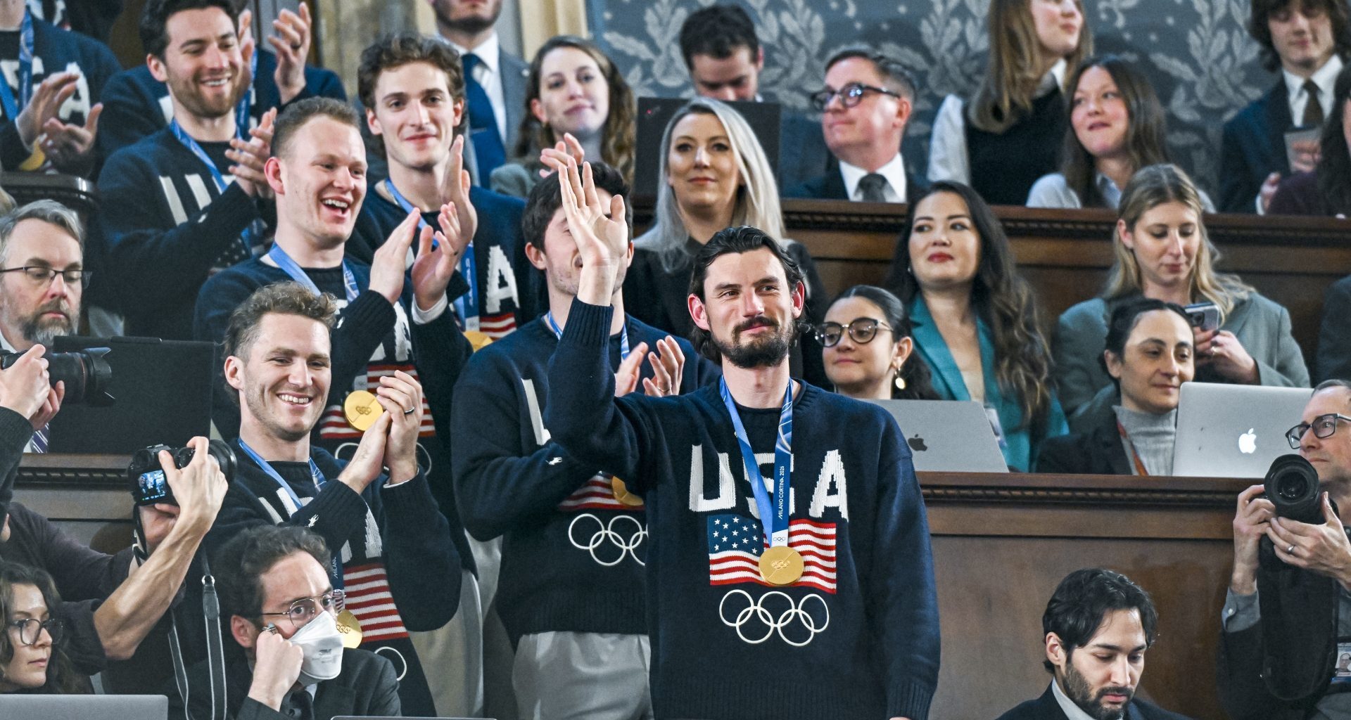 Feb 24, 2026; Washington, DC, USA; The United States Olympic Men’s Ice Hockey Team, Connor Hellebuyck in front, as President Donald J. Trump delivers the first State of the Union address of his second term to a joint session of Congress in the House Chamber of the United States Capitol in Washington on Tuesday