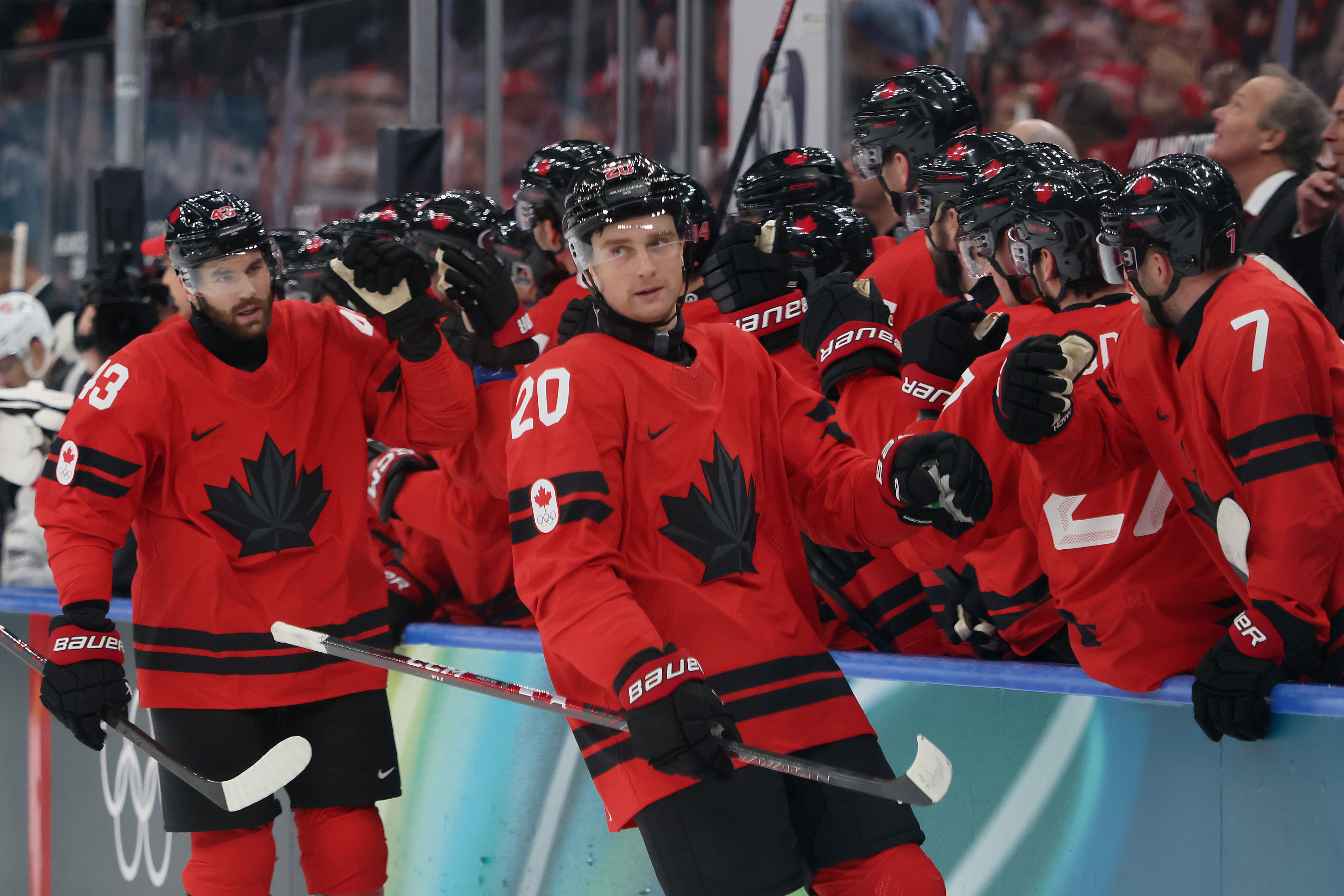 Thomas Harley #20 of Team Canada celebrates with teammates after scoring a goal in the first period during the Men's Preliminary Group A match between Canada and Switzerland on day seven of the Milano Cortina 2026 Winter Olympic games at Milano Santagiulia Ice Hockey Arena on Feb. 13, 2026 in Milan, Italy. (Photo by Bruce Bennett/Getty Images)