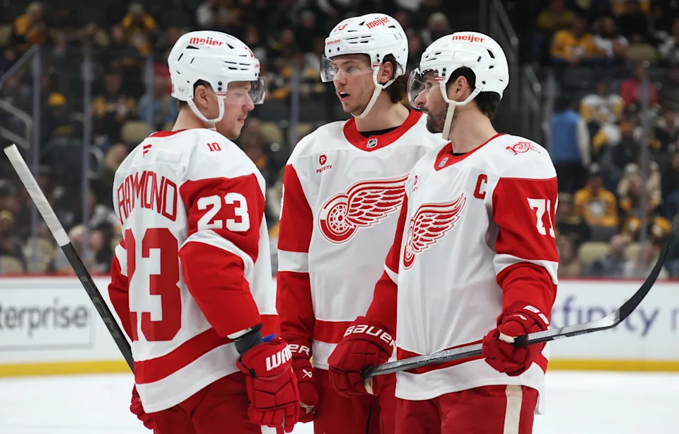 Jan 1, 2026; Pittsburgh, Pennsylvania, USA; Detroit Red Wings left wing Lucas Raymond (23) and defenseman Moritz Seider (53) and center Dylan Larkin (71) talk before a face-off against the Pittsburgh Penguins during the third period at PPG Paints Arena. Mandatory Credit: Charles LeClaire-Imagn Images