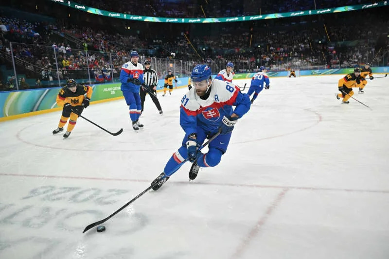 Slovakia's Erik Cernak on the puck during the men's quater final Ice hockey match between Slovakia and Germany, as part of the 2026 Winter Olympic Games in Milan-Cortina. Peter Kneffel/dpa