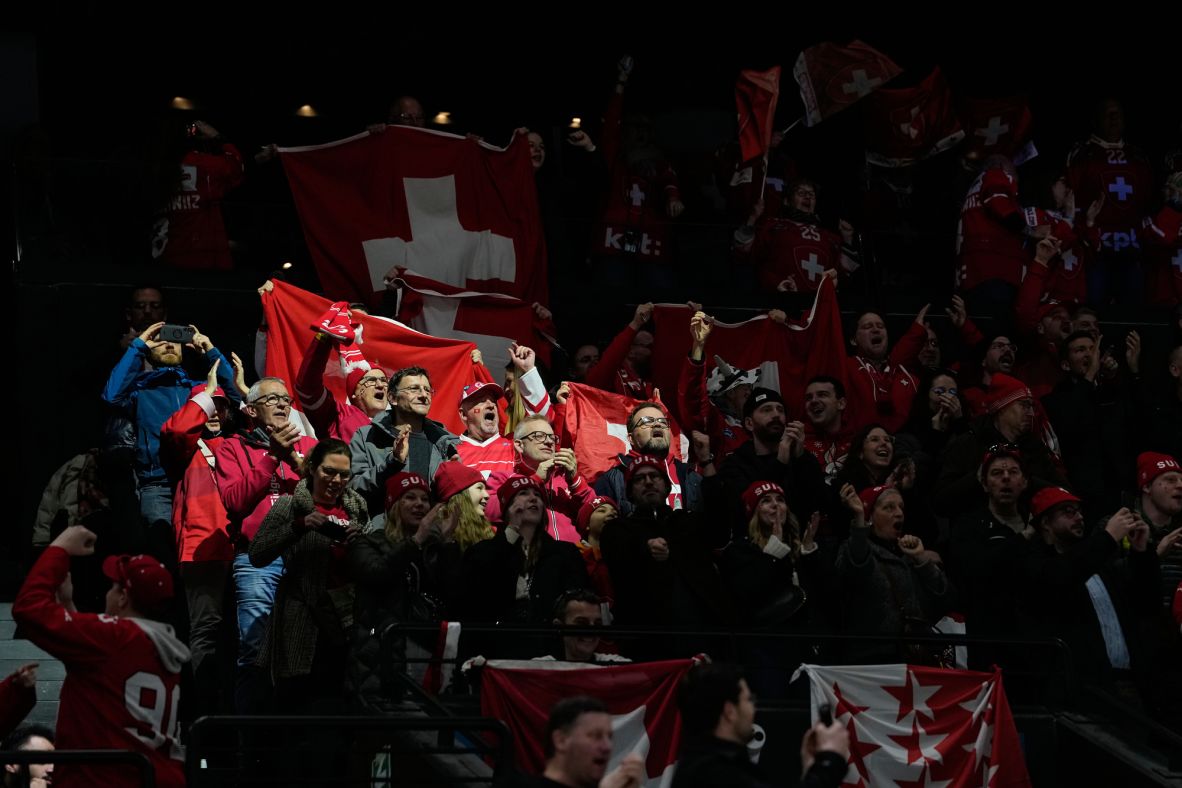 Switzerland supporters cheer during a preliminary hockey game between Switzerland and the Czech Republic on February 15.