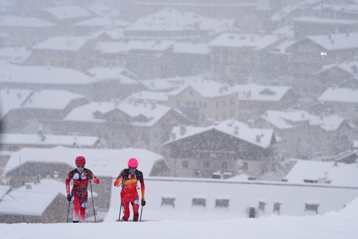 Switzerland's Jon Kistler, left, and Spain's Oriol Cardona Coll compete in the men's ski mountaineering sprint on February 19. Cardona Coll <a href=