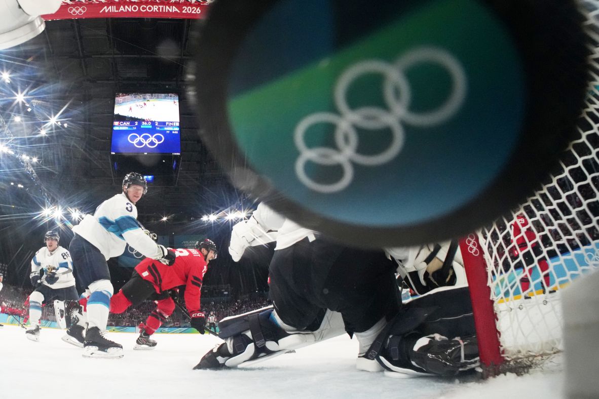 Canada's Nathan MacKinnon, not seen, scores his team's game-winning goal against Finland on February 20. Canada <a href=
