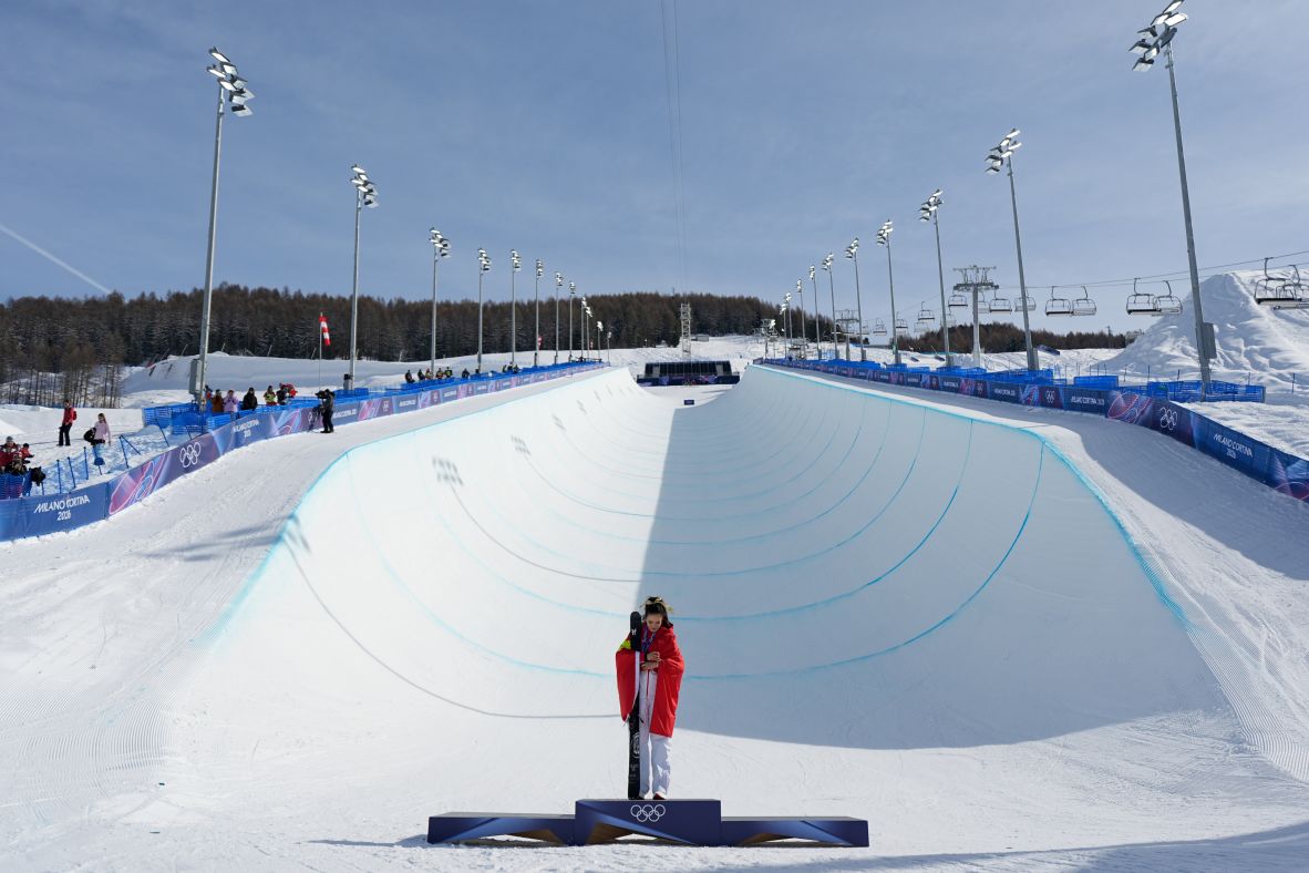 Gu looks at her gold medal after <a href=