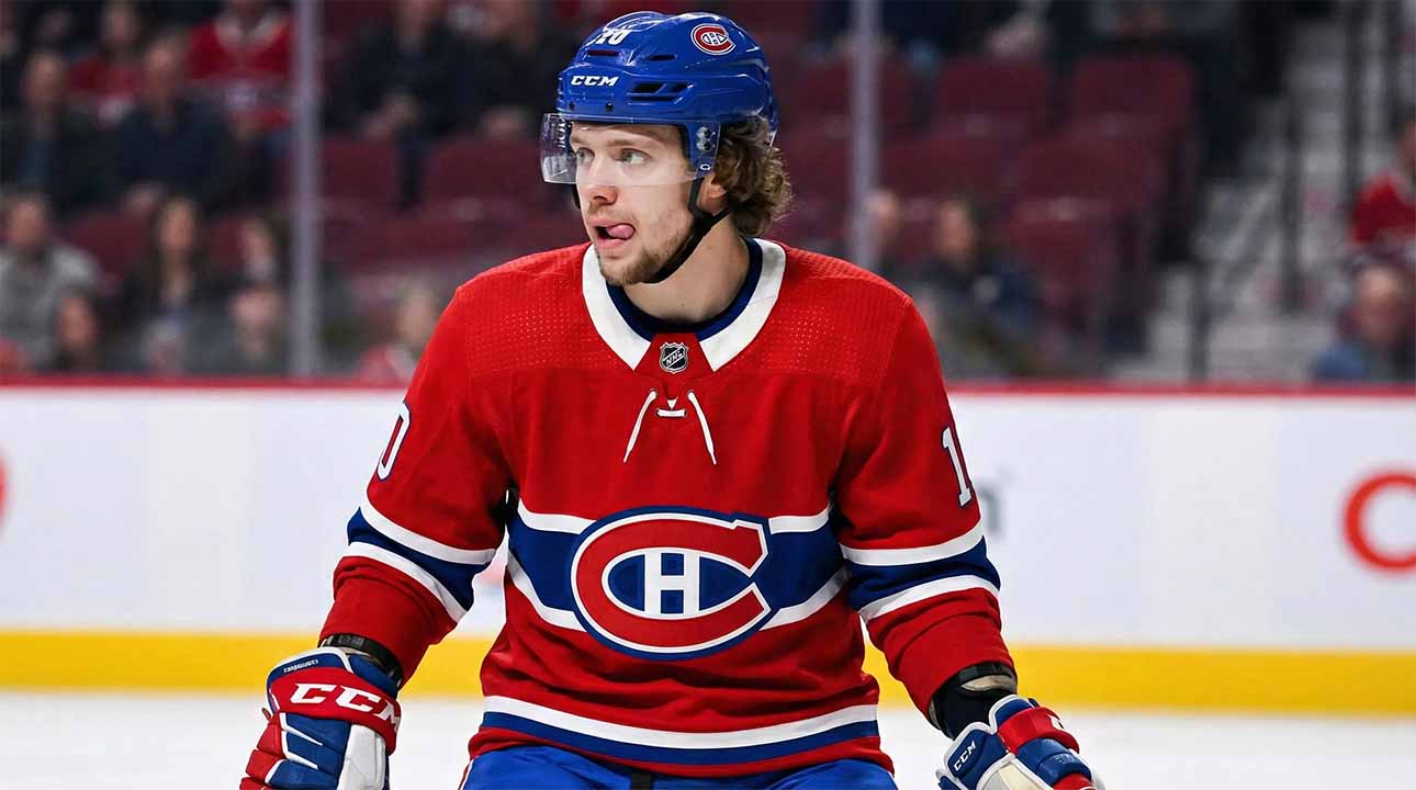 Artemi Panarin depicted wearing a red Montreal Canadiens home uniform and blue helmet, standing on the ice with his tongue sticking out during a game.