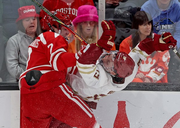 Nick Roukounakis of the Boston University Terriers checks Brady Berard of the Boston College Eagles during the first period of the Beanpot championship at TD Garden. (Photo By Matt Stone/Boston Herald)