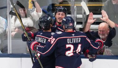 Columbus Blue Jackets defenseman Zach Werenski, center, celebrates his goal with teammates Cole Sillinger, left, and Mathieu Olivier (24) in the first period of an NHL hockey game against the Toronto Maple Leafs in Columbus, Wednesday, Oct. 29, 2025. (AP Photo/Sue Ogrocki)