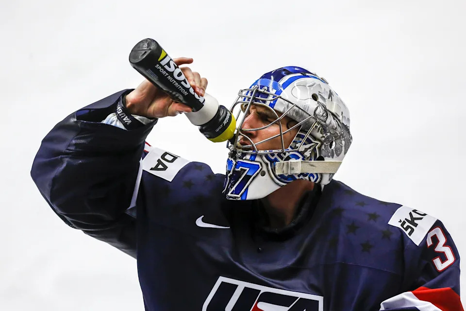Commerce Township's Connor Hellebuyck, goalie for the United States, refreshes himself during the IIHF World Championship match against Slovakia on Tuesday, May 12, 2015, in Ostrava, Czech Republic.