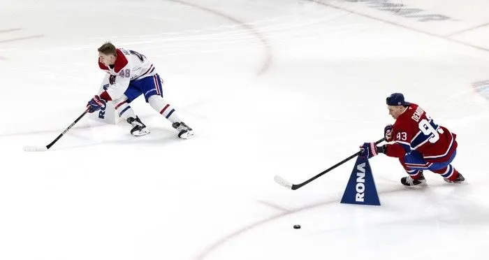  Montreal Canadiens defenceman Lane Hutson (48) and right wing Ivan Demidov (93) compete in the obstacle course during the team’s skills competition at the Bell Centre on Sunday, February 22, 2026.