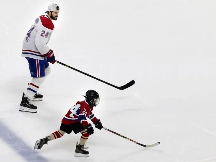  Montreal Canadiens centre Phillip Danault encourages his son Phillip-Édouard as he competes in the speed trials during the team’s skills competition at the Bell Centre on Sunday, February 22, 2026.