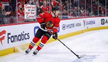 Connor Murphy, Chicago Blackhawks defenseman, skated with the puck during an NHL game with the message "GOOD LUCK ON YOUR NEW TEAM CONNOR!" written on the rink glass, fueling trade rumors to the Dallas Stars and Boston Bruins in 2026.