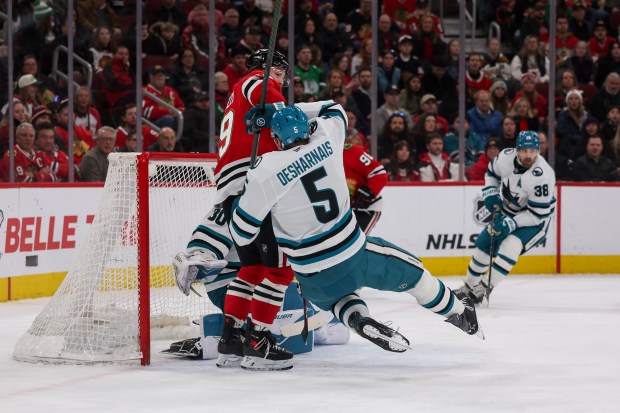 San Jose Sharks defenseman Vincent Desharnais (5) falls on the ice during the first period against the Chicago Blackhawks at the United Center Monday Feb. 2, 2026 in Chicago. (Armando L. Sanchez/Chicago Tribune)