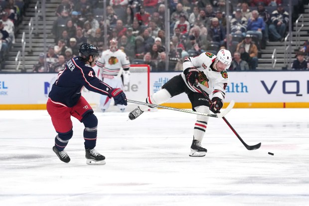 Ryan Donato of the Chicago Blackhawks passes the puck against Cole Sillinger of the Columbus Blue Jackets during the first period at Nationwide Arena on Feb. 4, 2026, in Columbus, Ohio. (Jason Mowry/Getty Images)