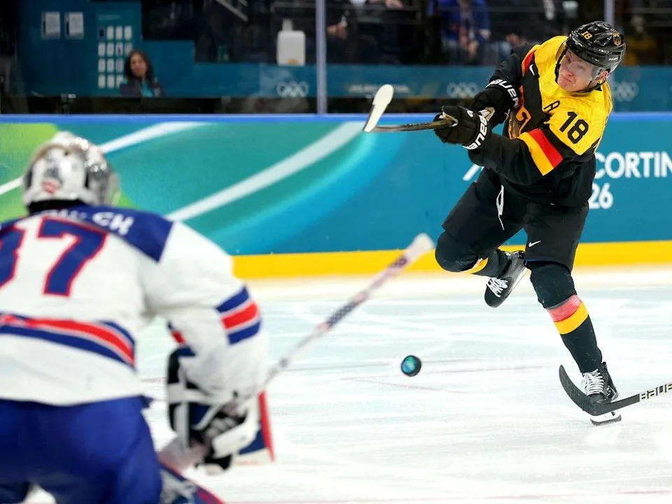  Tim Stutzle of Team Germany shoots the puck against Connor Hellebuyck of Team USA in a game at the Olympics on Feb. 15, 2026 in Milan, Italy. Stutzle has six points, including four goals, in four games.