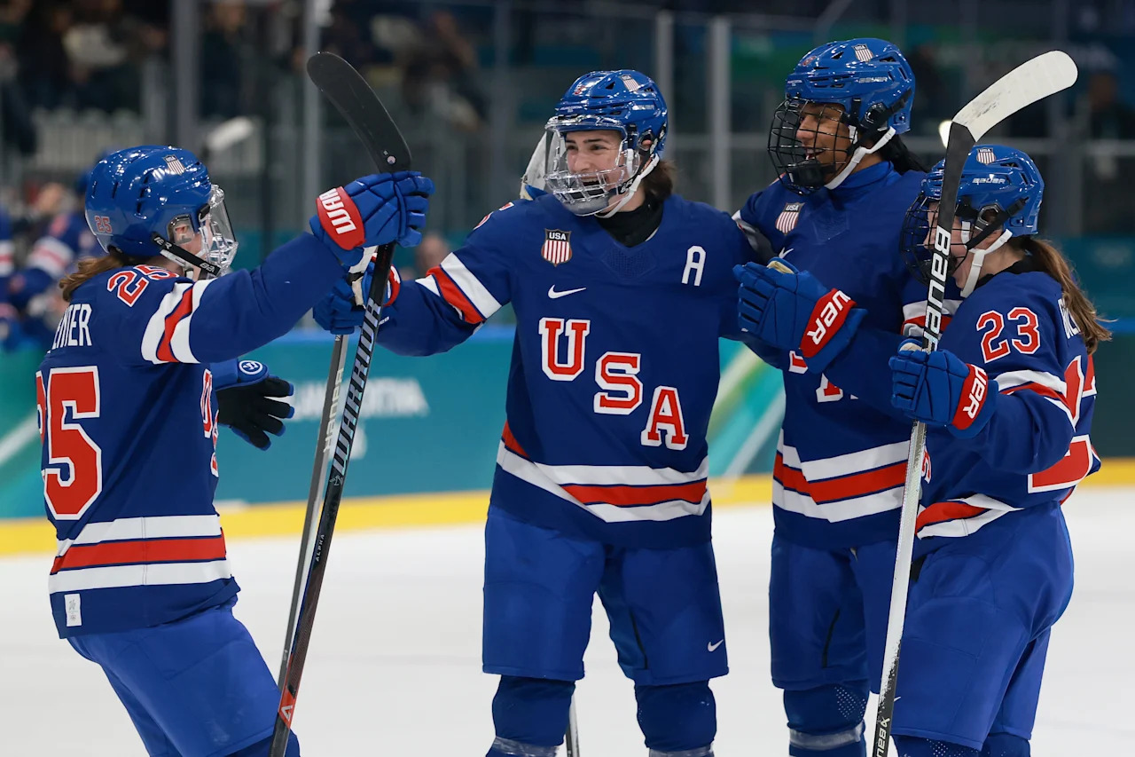 MILAN, ITALY - FEBRUARY 13: Megan Keller #5 of Team United States celebrates a goal with teammates in the first period during the Women's Quarterfinals match between the United States and Italy on day seven of the Milano Cortina 2026 Winter Olympic games at Milano Rho Ice Hockey Arena on February 13, 2026 in Milan, Italy. (Photo by Elsa/Getty Images)