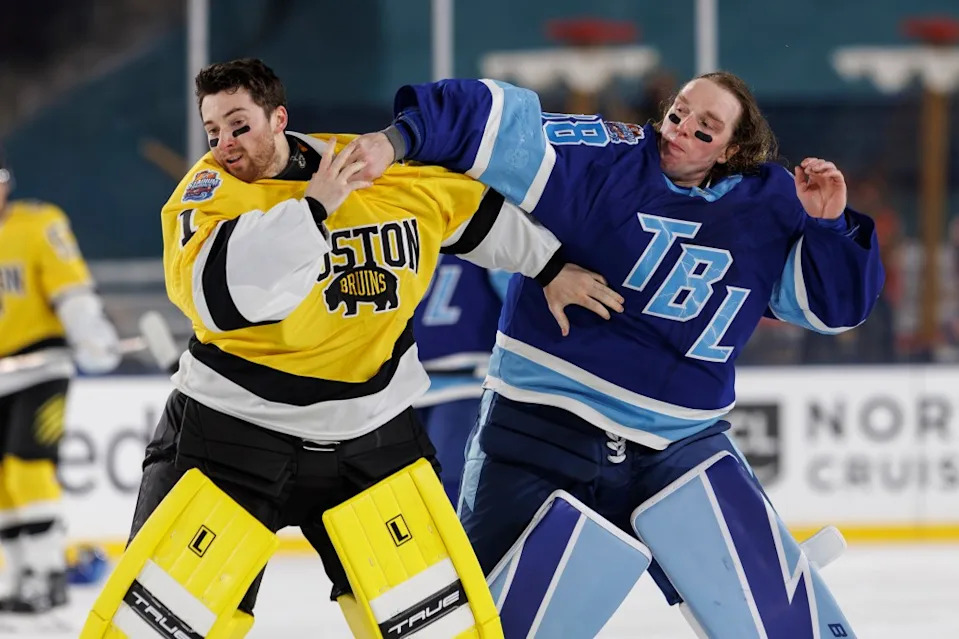Andrei Vasilevskiy #88 of the Tampa Bay Lightning fights against goalie Jeremy Swayman #1 of the Boston Bruins during the second period during the NHL Stadium Series game NHLI via Getty Images