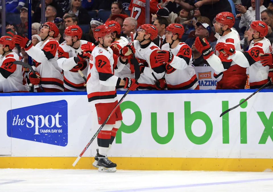 Dec 18, 2025; Tampa, Florida, USA; Carolina Hurricanes right wing Andrei Svechnikov (37) is congratulated after he scored a goal against the Tampa Bay Lightning during the third period at Benchmark International Arena. Mandatory Credit: Kim Klement Neitzel-Imagn Images