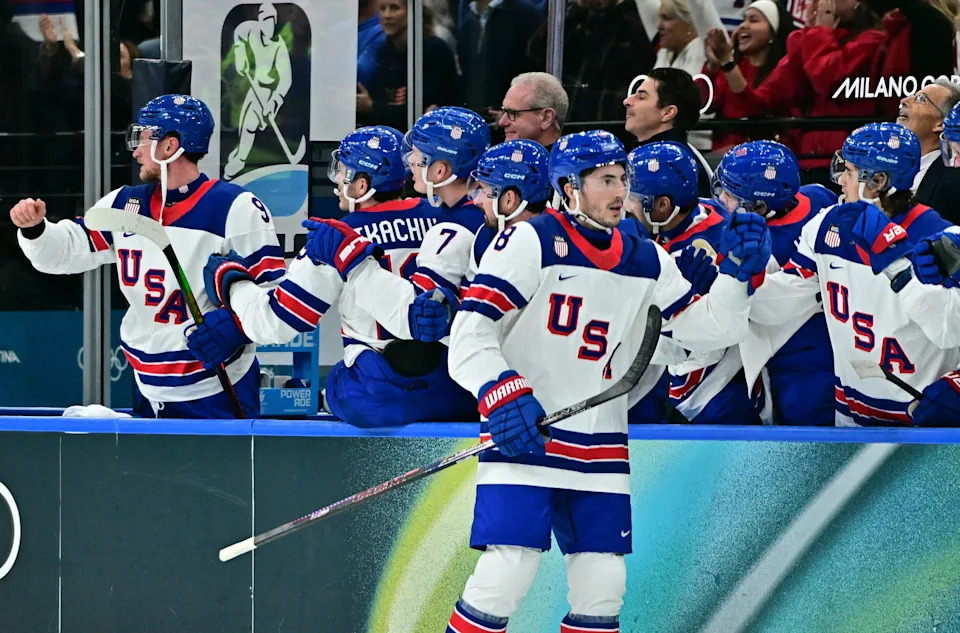 Zach Werenski of United States celebrates scoring their first goal with teammates against Germany in men's ice hockey group A play during the Milano Cortina 2026 Olympic Winter Games at Milano Santagiulia Ice Hockey Arena.