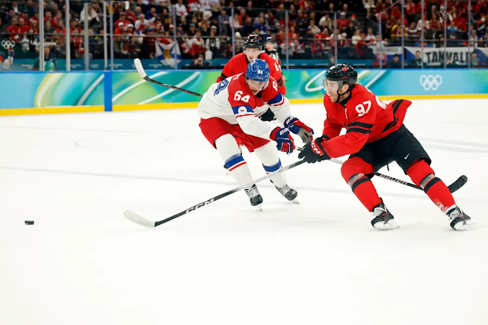 Feb 18, 2026; Milan, Italy; Connor McDavid of Canada battles for the puck against David Kampf of Czechia in a men's ice hockey quarterfinal during the Milano Cortina 2026 Olympic Winter Games at Milano Santagiulia Ice Hockey Arena. Mandatory Credit: Geoff Burke-Imagn Images